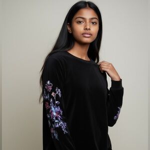 Susan Graver Medium ladies black sweater very good condition. Embroidered sleeve